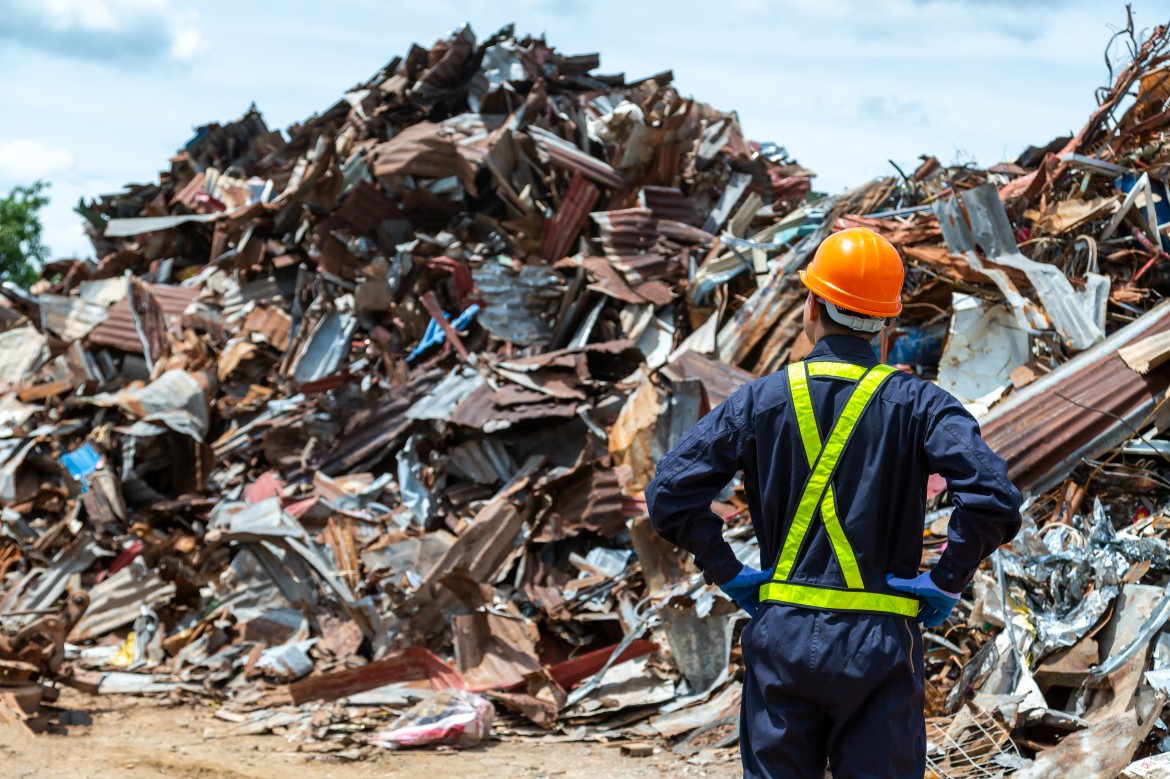 Engineer evaluating construction waste recycling site