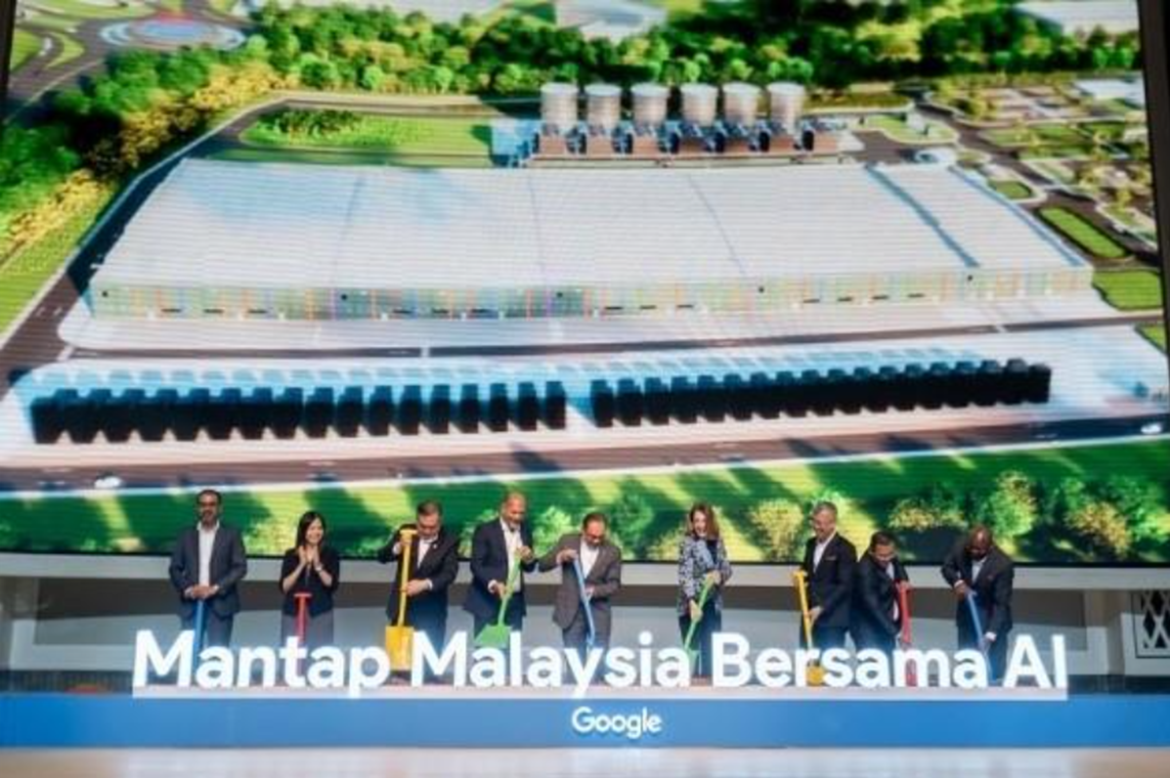 Executives participating in the groundbreaking ceremony for Google&rsquo;s first data centre in Malaysia at Elmina Business Park, shown in front of a large project visualization screen.